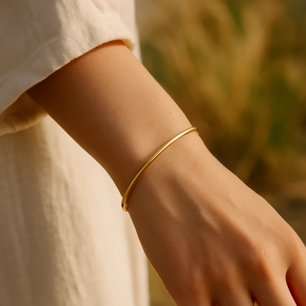 Delicate gold bracelet on a wrist